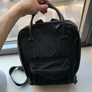 All black Fjallraven mini backpack